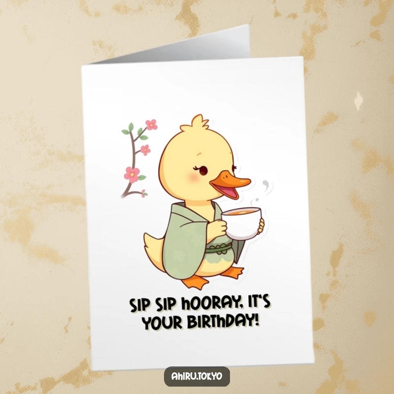 Funny Free Printable Birthday Card: A duck in a patterned kimono sips tea from a tiny cup with a look of pure delight.